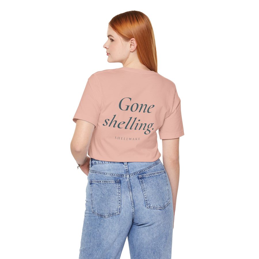 Back of the tee with the phrase Gone shelling.
